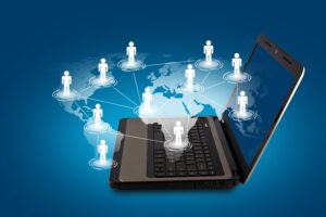 Global digital network concept with laptop and connected people icons on world map background